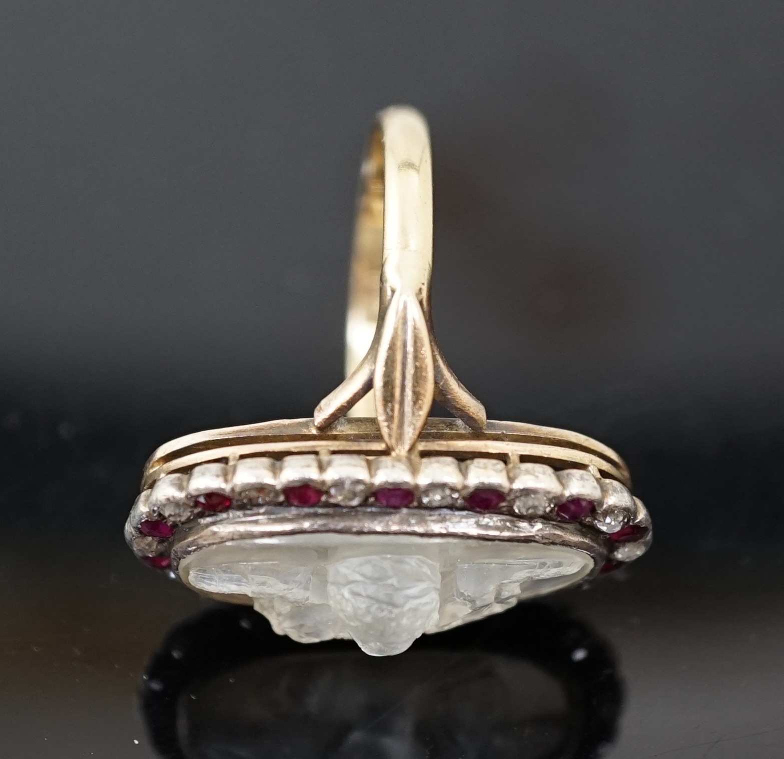 A 1930's continental 14k gold, moonstone?, ruby and diamond cluster set upfinger ring